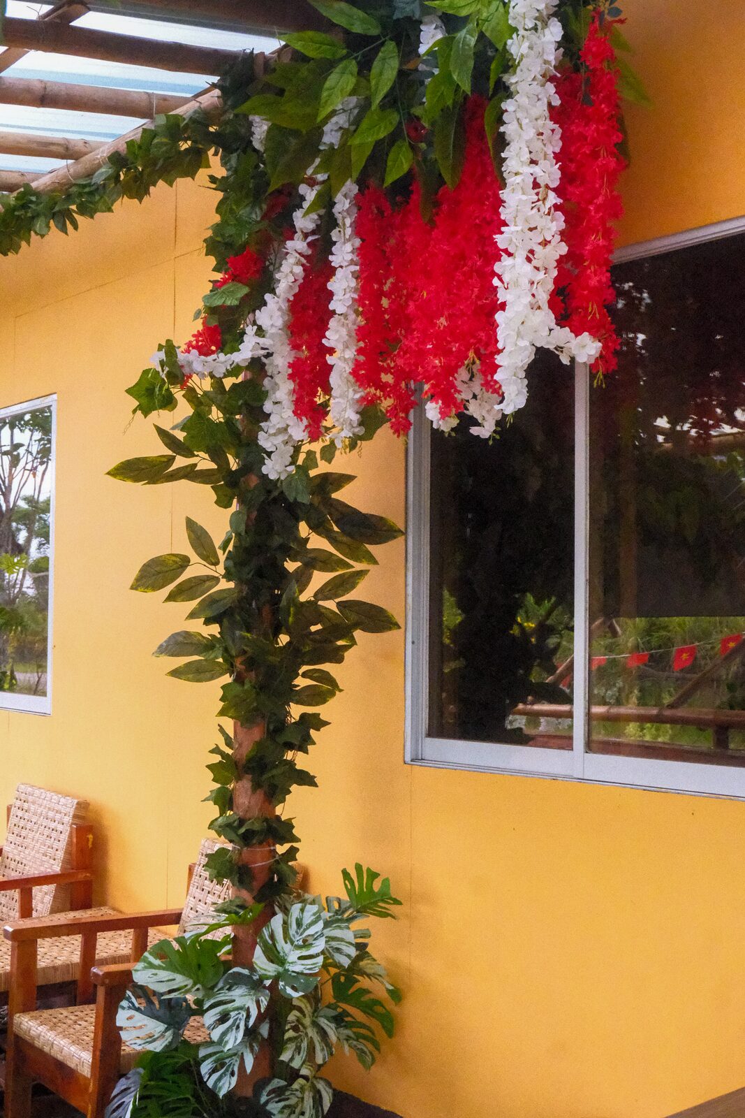 Silk lanterns on the yellow café wall