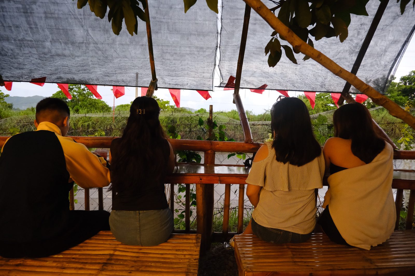 Friends taking in the garden view at dusk